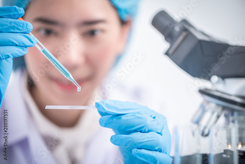 scientist with equipment an...