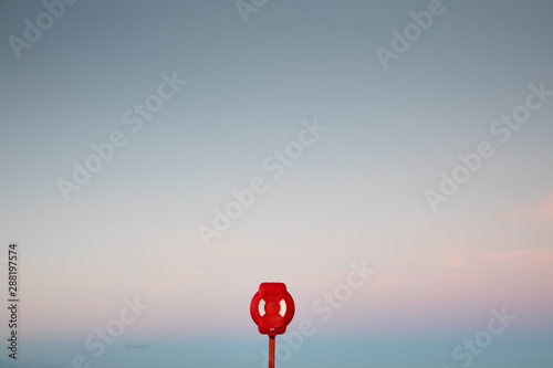 A lifebuoy against a clear sky