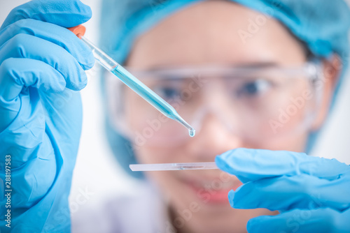 scientist with equipment an...