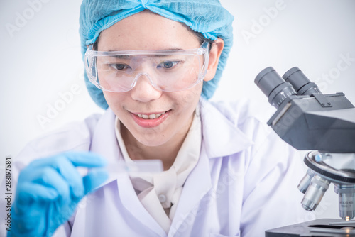 scientist with equipment an...