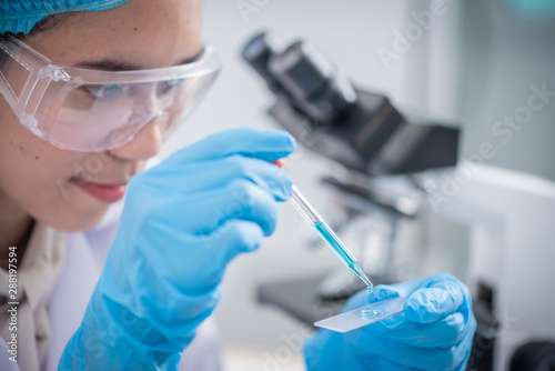 scientist with equipment an...