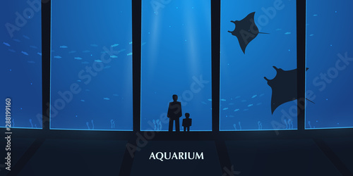Big Aquarium or Oceanarium With crampfish. People with children watching the underwater world.