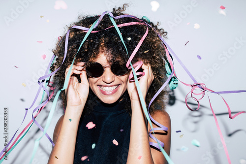 Mixed race woman celebrating a party photo