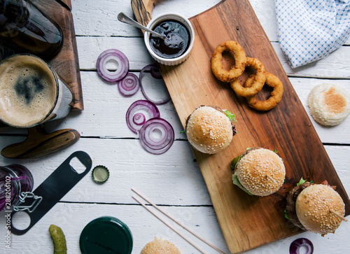 Mouth-watering burger on wooden board photo