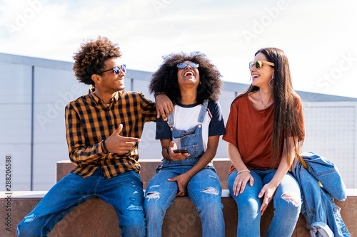 Group of happy friends having fun in the street