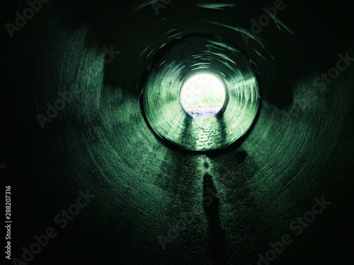 Drainage pipe under the highway photo