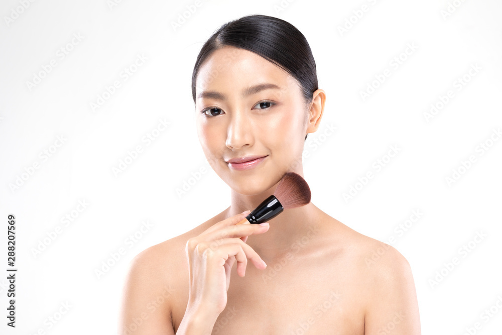 Beautiful Asian young woman smile and holding make up brush with healthy Clean and Fresh skin feeling so happiness and cheerful,Isolated on white background,Beauty Concept Beautiful Asian young woman smile and holding make up brush with healthy Clean and Fresh skin feeling so happiness and cheerful,Isolated on white background,Beauty Concept