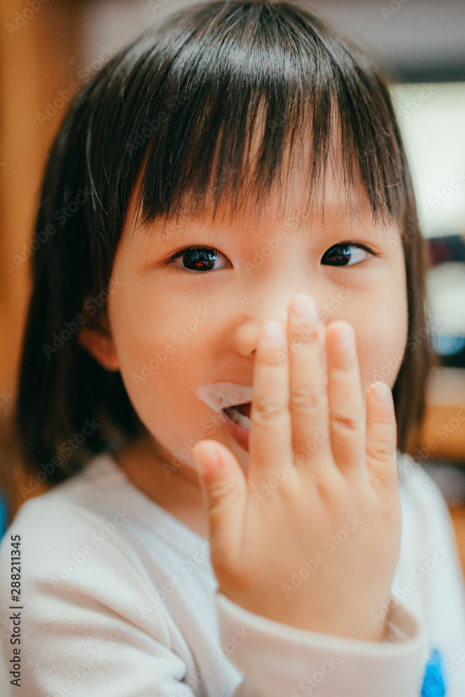 little girl with milk on her lip little girl with milk on her lip