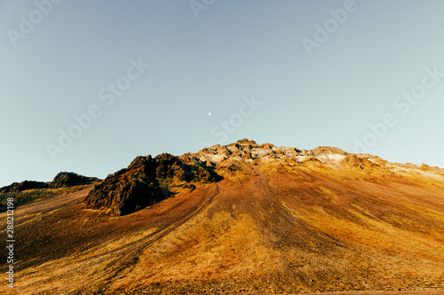 Daytime Moon Over Mountainous Icelandic Fall Landscape photo