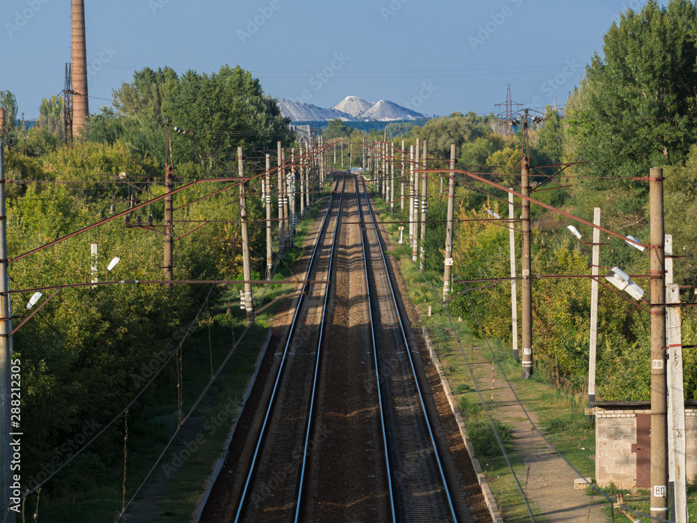 Fototapeta premium Railroad way going to hills