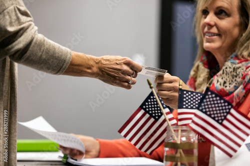 Election: Voting Official Checking Voter Identification Before V