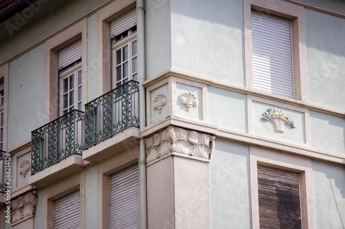 Corner of the house with decorative balcony photo