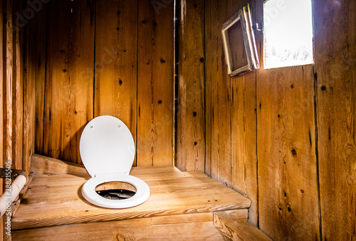 old wooden outhouse photo