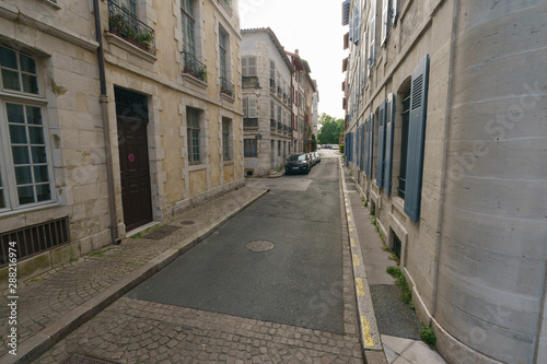Narrow streets of medieval city Bayonne in summer day. Troubles of tourism. © Yury and Tanya