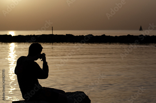 silhouette of a man at sunset