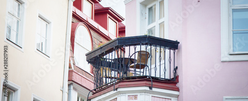 balcony of the house with table and chairs photo
