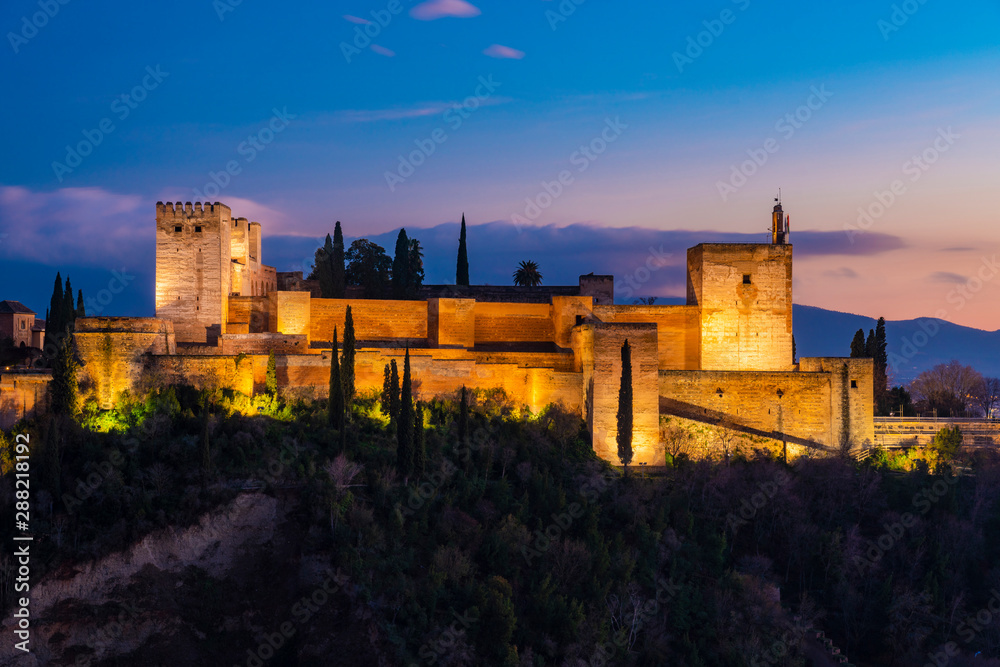 View of Alhambra with Sierra Nevada in the background at sunset, Granada, Spain View of Alhambra with Sierra Nevada in the background at sunset, Granada, Spain