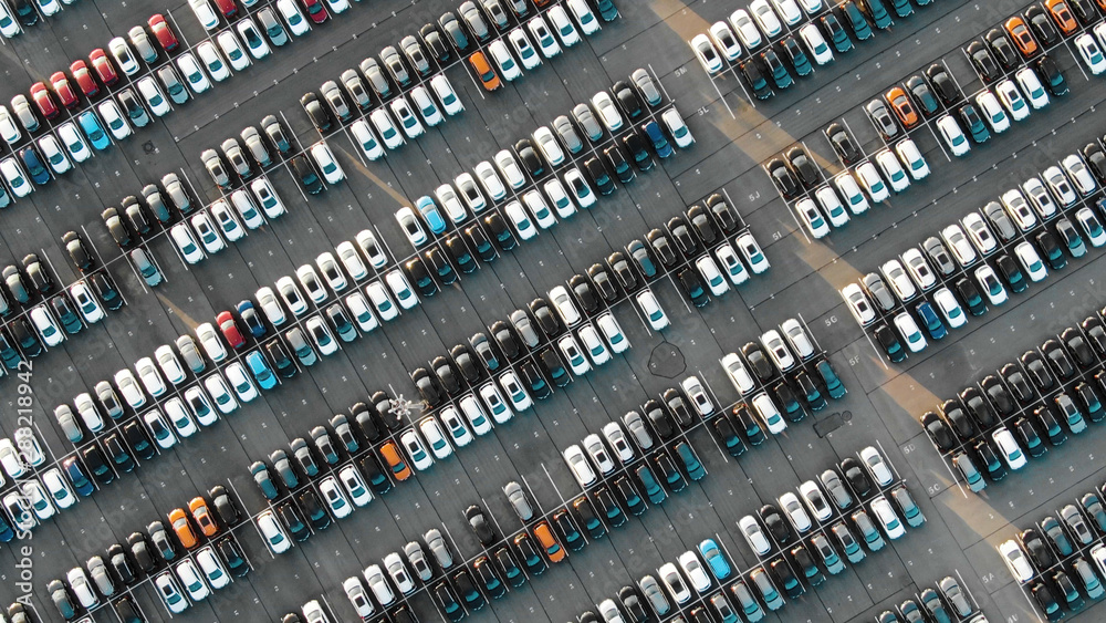 large automobile rows on modern warehouse parking area