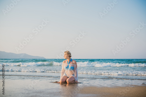 Plus size woman in holidays, Picturesque view of the beach. Vacations and adventure concept 