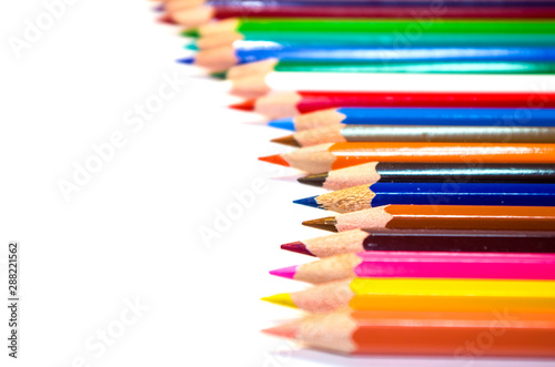 Many color pencils isolated on white background with copy space for text.Close up.