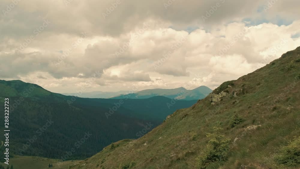 The four active people standing on a mountain The four active people standing on a mountain