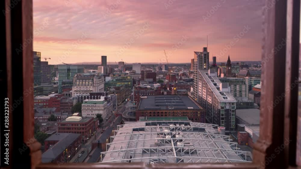 Manchester city timelapse day to nigh seen through a window high point of view uk england