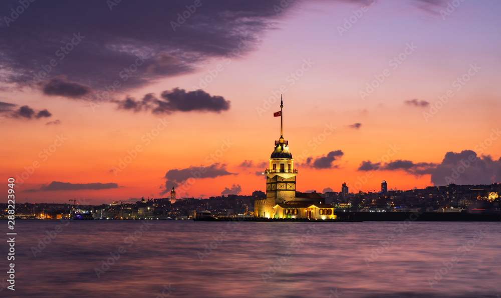 turkish tower in sea on sunset evening, violet sky summer