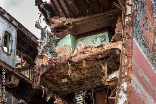 Internal parts of decommissioned marine ship that was cut and left on the shore. photo