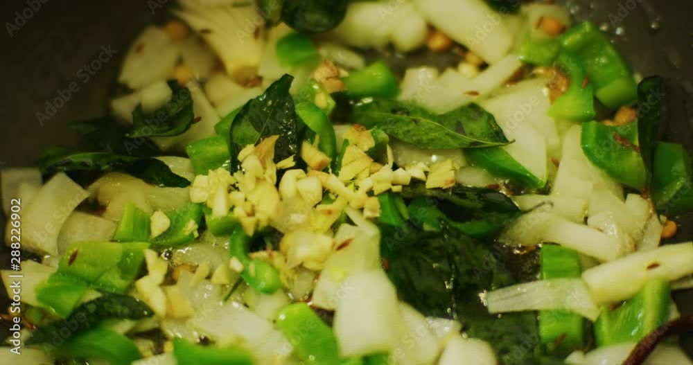 Slow motion shot of cooking a simple and easy vegetarian curry. Slow motion shot of cooking a simple and easy vegetarian curry.