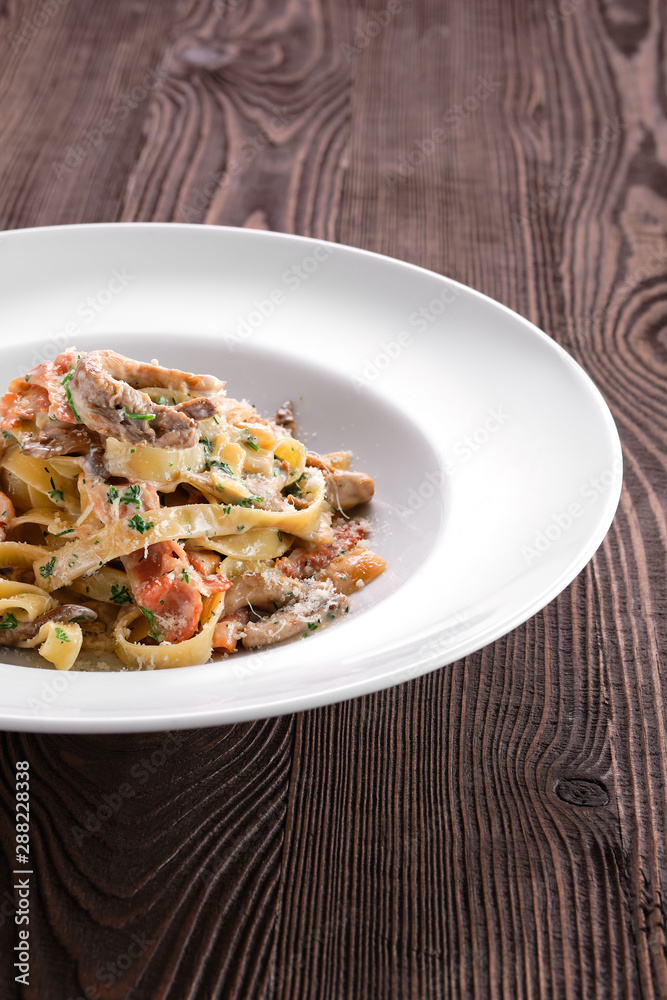 Pasta with bacon and squid