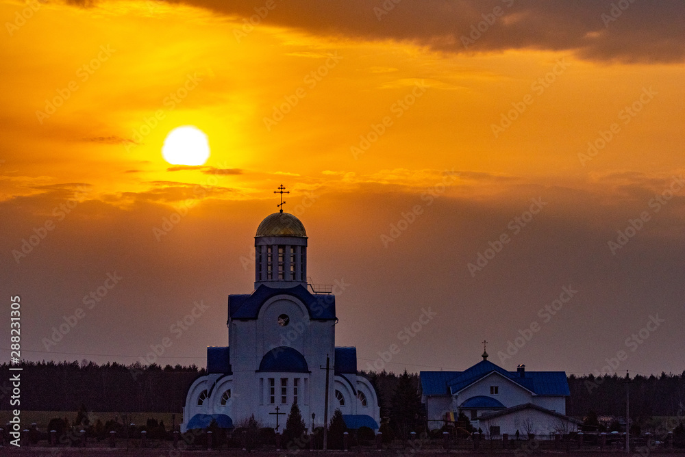 Small village church on a sunset background. Small village church on a sunset background.