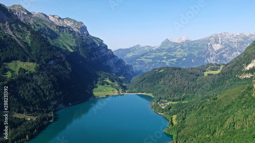 Klöntalersee lake in mountains. Kanton Glarus, Switzerland. Aerial view.
