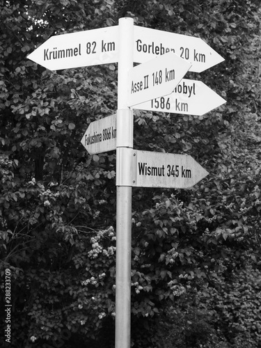 Dannenberg, Germany - May 12, 2019: Directional signs pointing at various locations of nuclear accidents photo