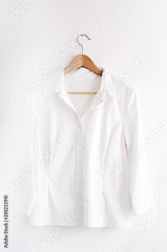 Shirt on a hanger isolated on white with bokeh on left