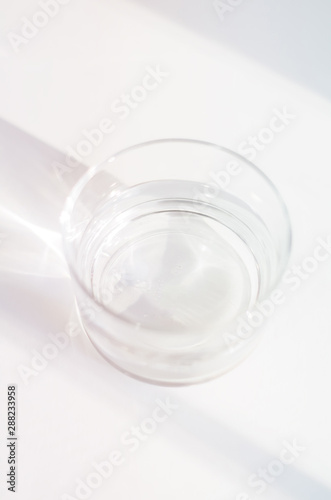 Abstract background with glass, water, ethereal light, shadows, with copy space