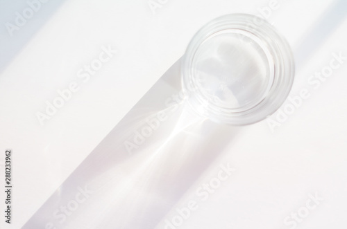 Abstract background with glass, water, ethereal light, shadows, with copy space