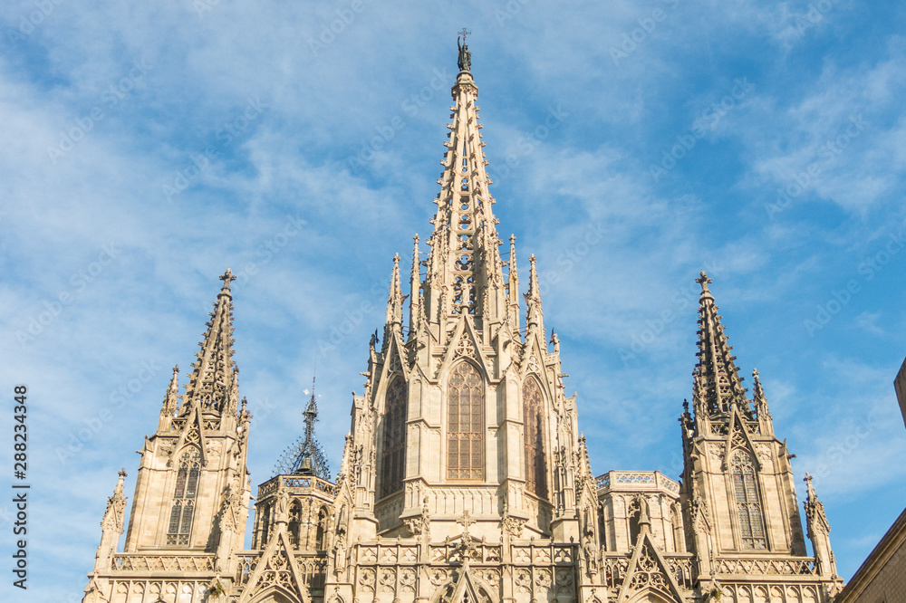 Facade of the Metropolitan Cathedral Basilica of Barcelona (also known as The Cathedral of the Holy Cross and Saint Eulalia) located in the gothic quarter in Catalonia, Spain, Europe. Facade of the Metropolitan Cathedral Basilica of Barcelona (also known as The Cathedral of the Holy Cross and Saint Eulalia) located in the gothic quarter in Catalonia, Spain, Europe.