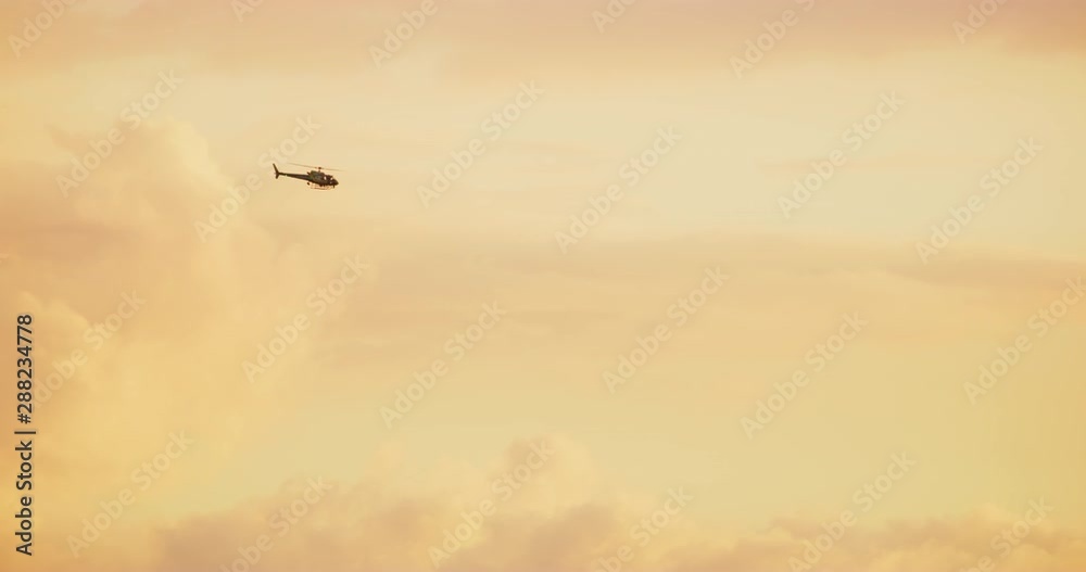 Helicopter seen in beautiful light during sunset in Los Angeles, California Helicopter seen in beautiful light during sunset in Los Angeles, California