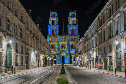 Fototapeta Naklejka Na Ścianę i Meble -  Joanna of Arc street that flows into the Church of the Holy Cross in Orleans, France. Illuminated with the technique called maping