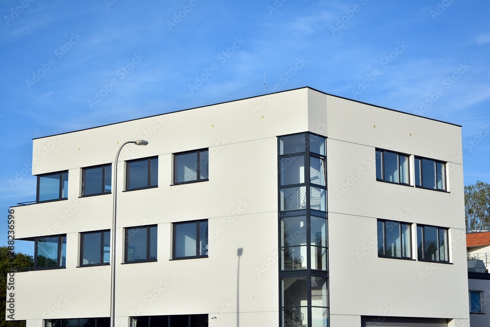 The windows of a modern building for offices. Business buildings architecture. The windows of a modern building for offices. Business buildings architecture.