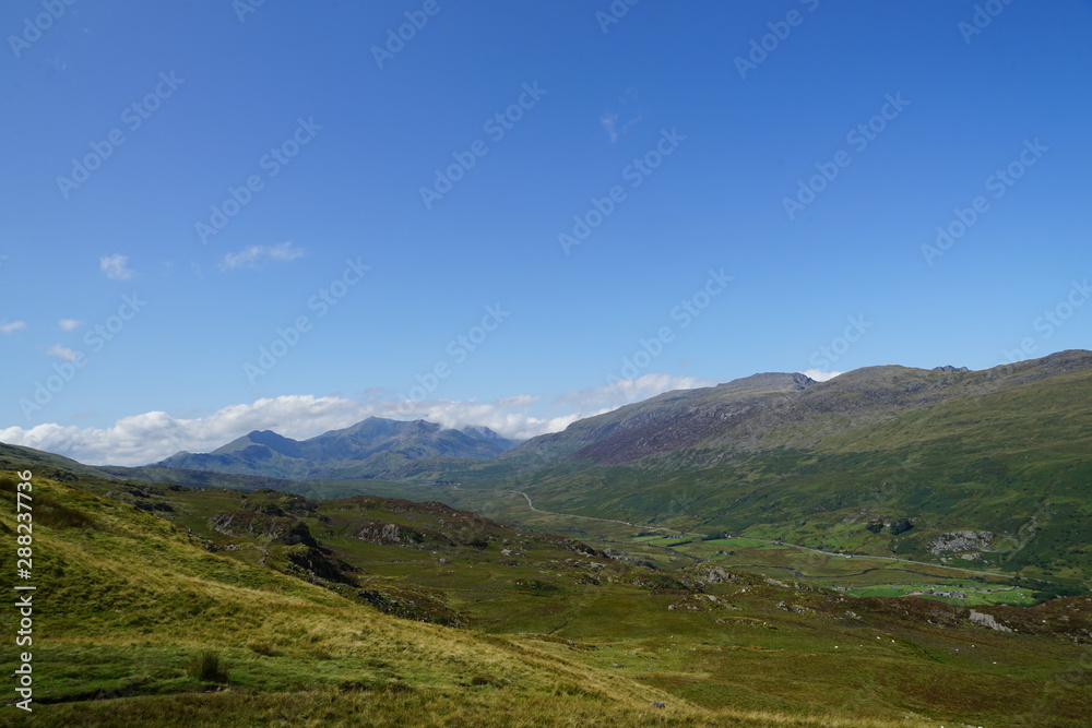 High Mountain Range with Brilliant Blue Sky and Clouds - Wales UK High Mountain Range with Brilliant Blue Sky and Clouds - Wales UK