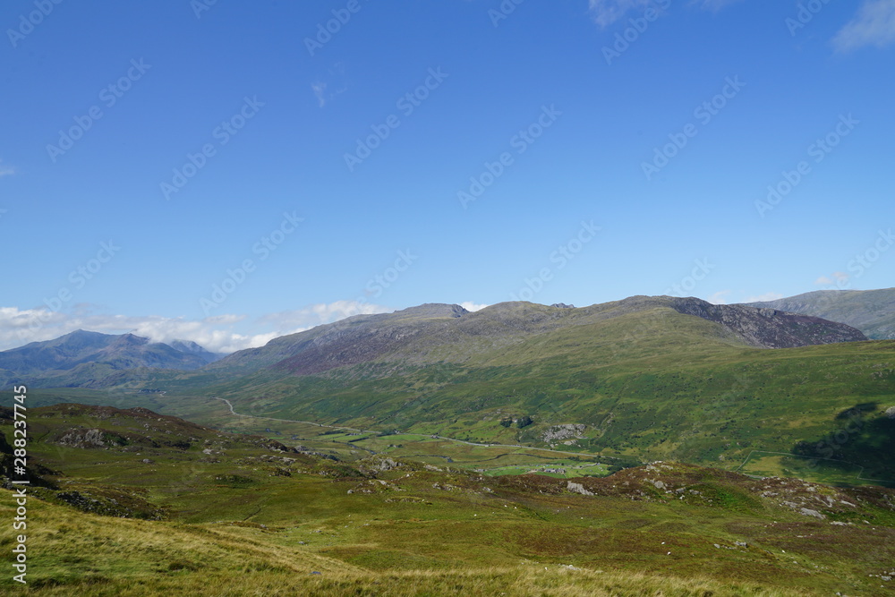 High Mountain Range with Brilliant Blue Sky and Clouds - Wales UK High Mountain Range with Brilliant Blue Sky and Clouds - Wales UK