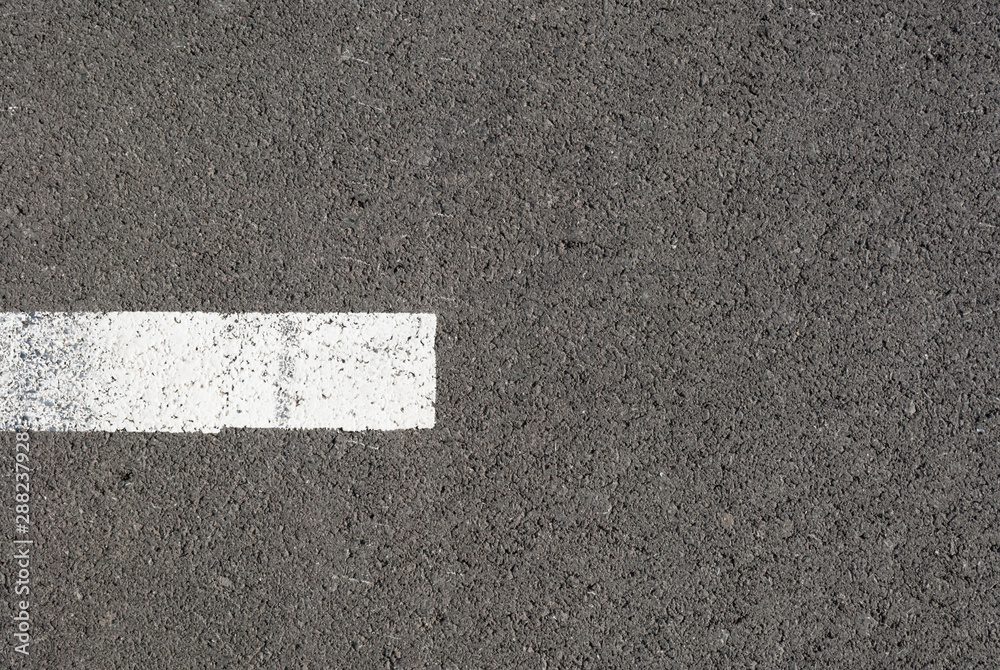 Fototapeta premium New asphalt texture with white dashed line