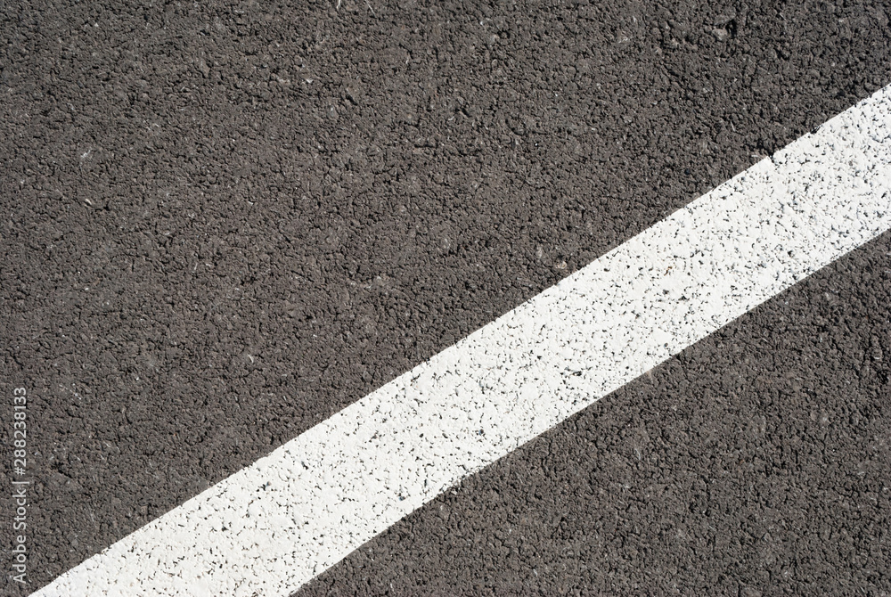 Fototapeta premium New asphalt texture with white line. Top view