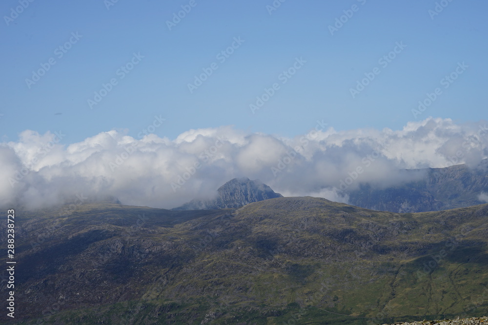 Mountain Range Covered in Clouds