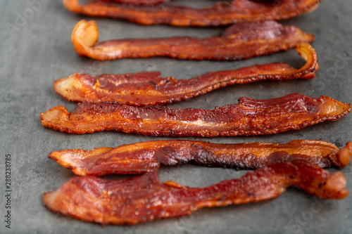 Cooked Bacon Stripes on Dark Background