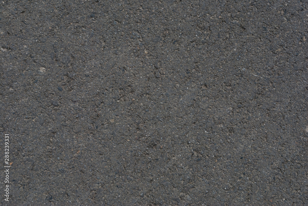 Smooth asphalt road. Tarmac dark grey grainy road background. Top view grunge rough surface Smooth asphalt road. Tarmac dark grey grainy road background. Top view grunge rough surface