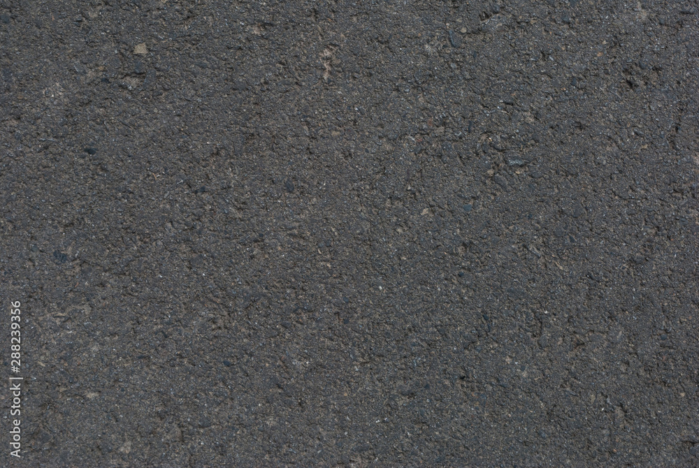 Smooth asphalt road. Tarmac dark grey grainy road background. Top view grunge rough surface Smooth asphalt road. Tarmac dark grey grainy road background. Top view grunge rough surface