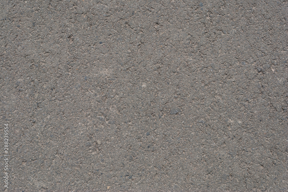 Smooth asphalt road. Tarmac dark grey grainy road background. Top view grunge rough surface Smooth asphalt road. Tarmac dark grey grainy road background. Top view grunge rough surface