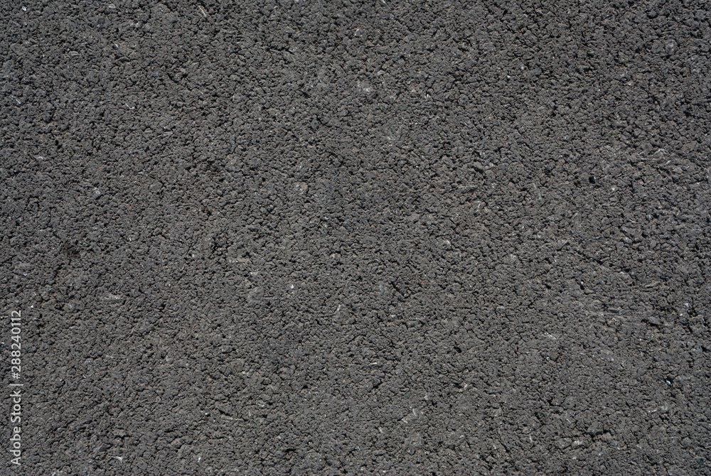 Smooth asphalt road. Tarmac dark grey grainy road background. Top view grunge rough surface Smooth asphalt road. Tarmac dark grey grainy road background. Top view grunge rough surface